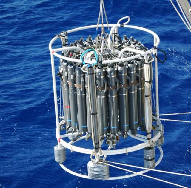 Researchers deploy a device called a CTD-rosette to collect deep water samples in the Bermuda Atlantic Time-series Study.